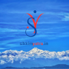 Tandem paragliding above the green hills of South Sikkim